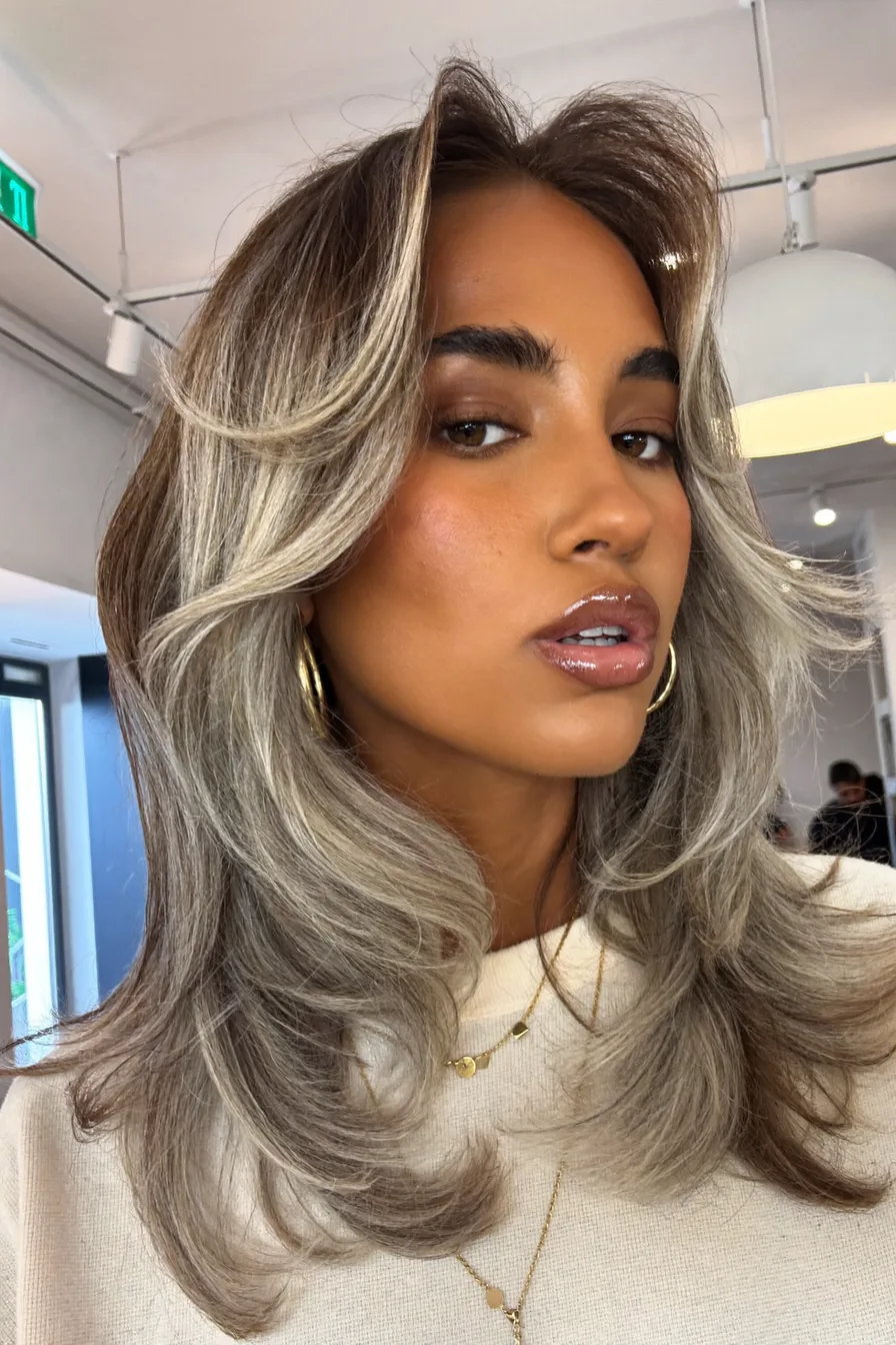 Voluminous Ash Blonde Long Layered Haircut with Face-Framing Layers