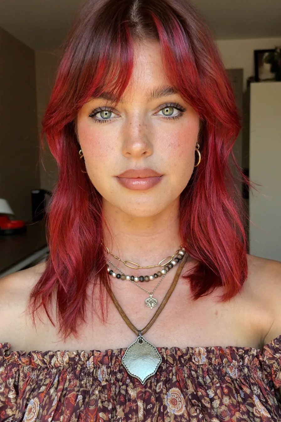 Face-Framing Auburn Red Long Layered Haircut With Wispy Bangs