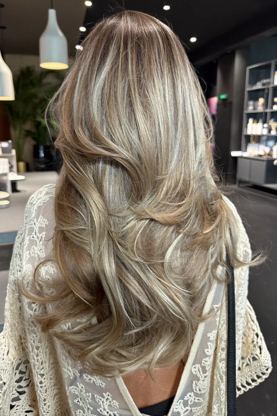 Voluminous Balayage Blonde Long Layered Haircut With Soft Waves