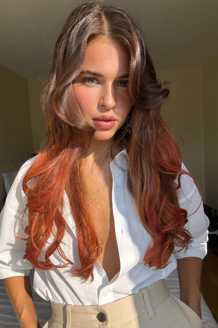 Voluminous Copper Red Long Layered Hair with Face-Framing Waves
