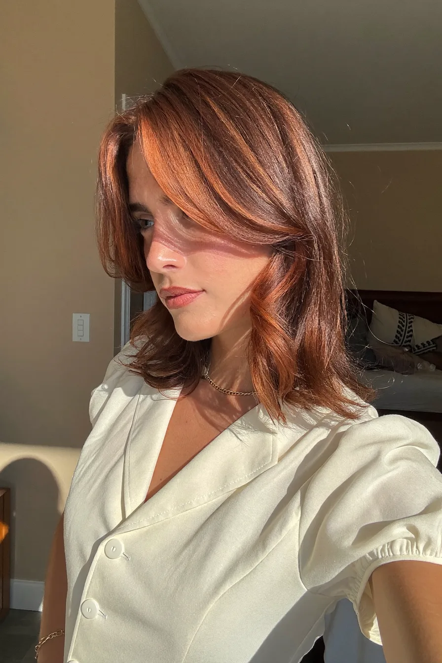Sun-Kissed Copper Red Long Layered Waves for Effortless Shine
