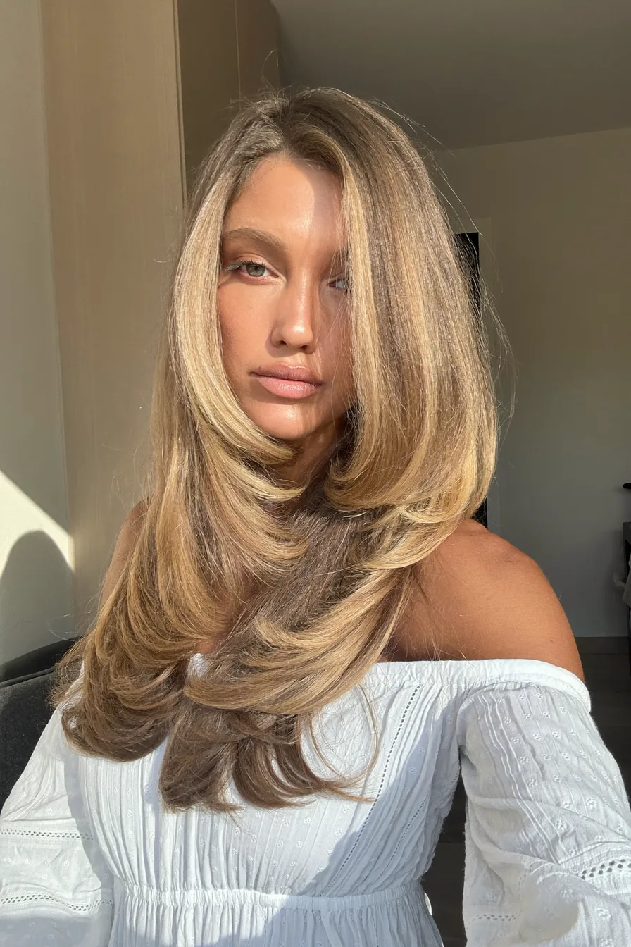 Sun-Kissed Golden Blonde Long Layered Blowout with Face-Framing Layers