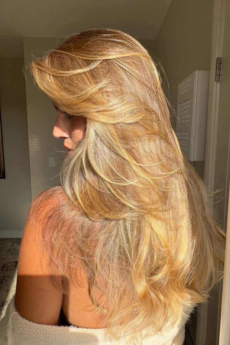 Softly Feathered Golden Blonde Long Layered Hair with Sunlit Shine