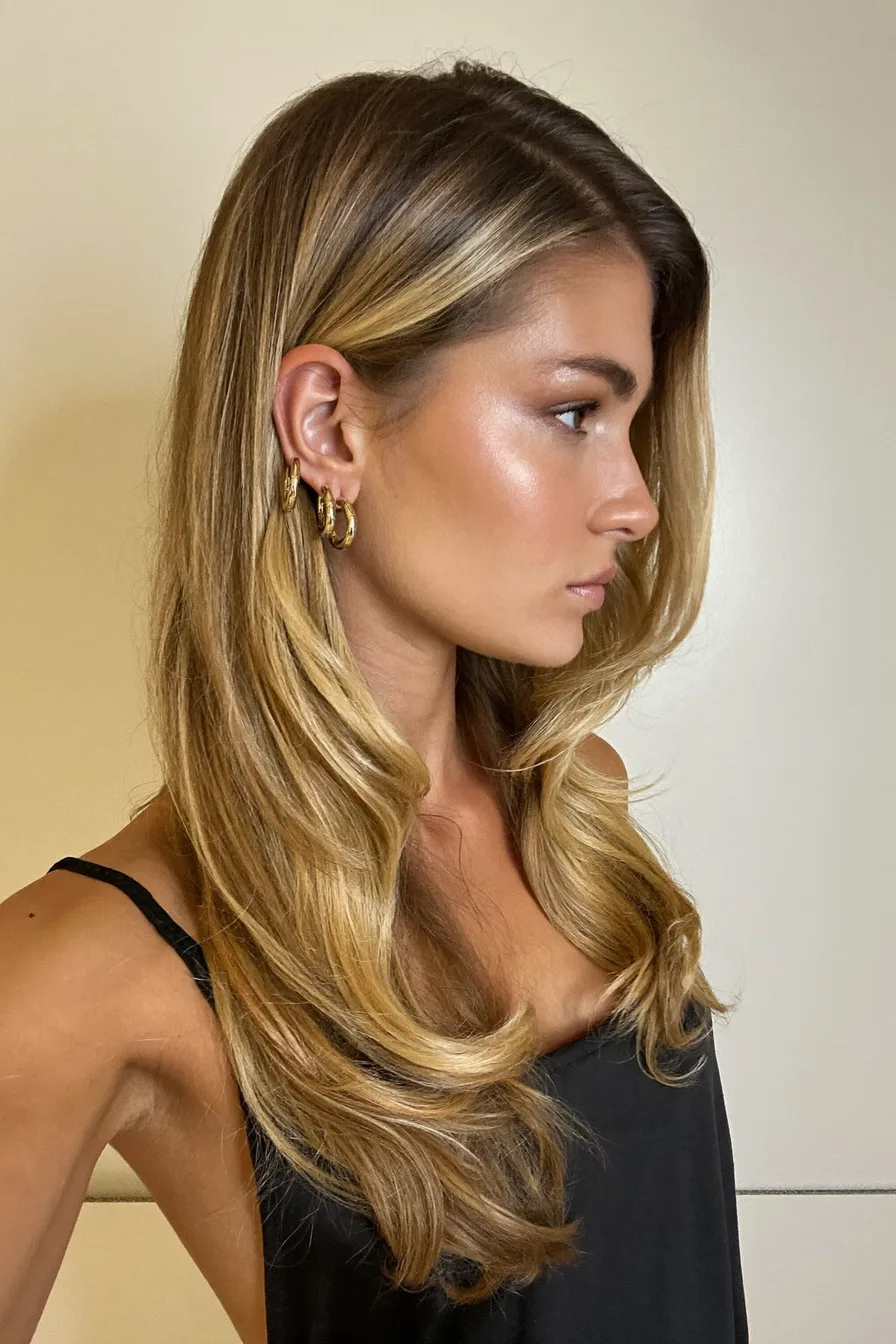 Sleek Honey Blonde Long Layered Cut with Face-Framing Waves
