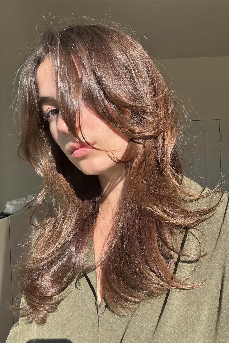Voluminous Long Layered Cut with Wispy Curtain Bangs for Natural Movement