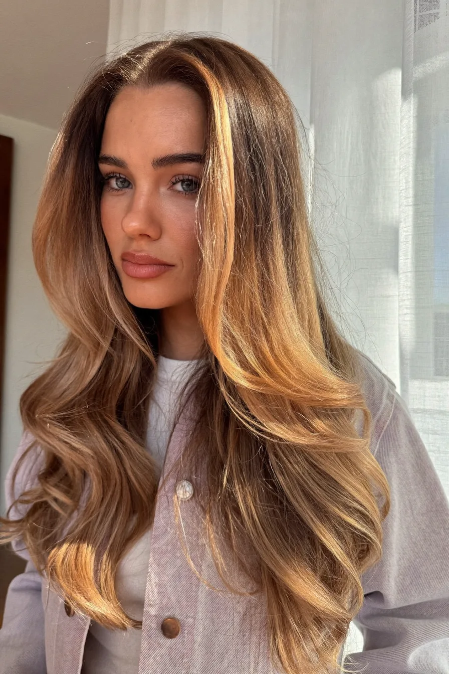Sun-Kissed Long Layered Haircut with Soft Face-Framing Layers