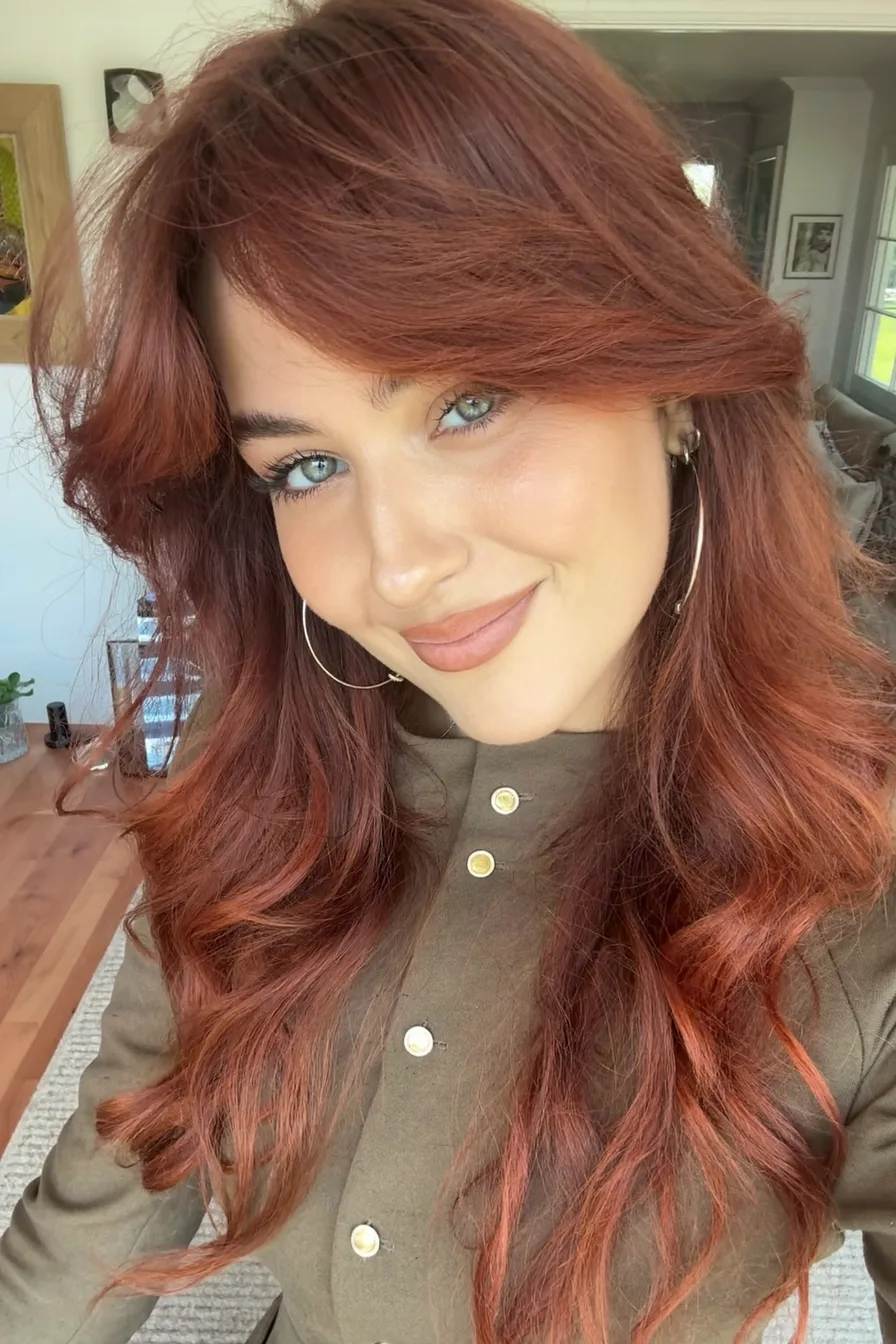 Effortlessly Chic Long Layered Haircut with Side-Swept Bangs