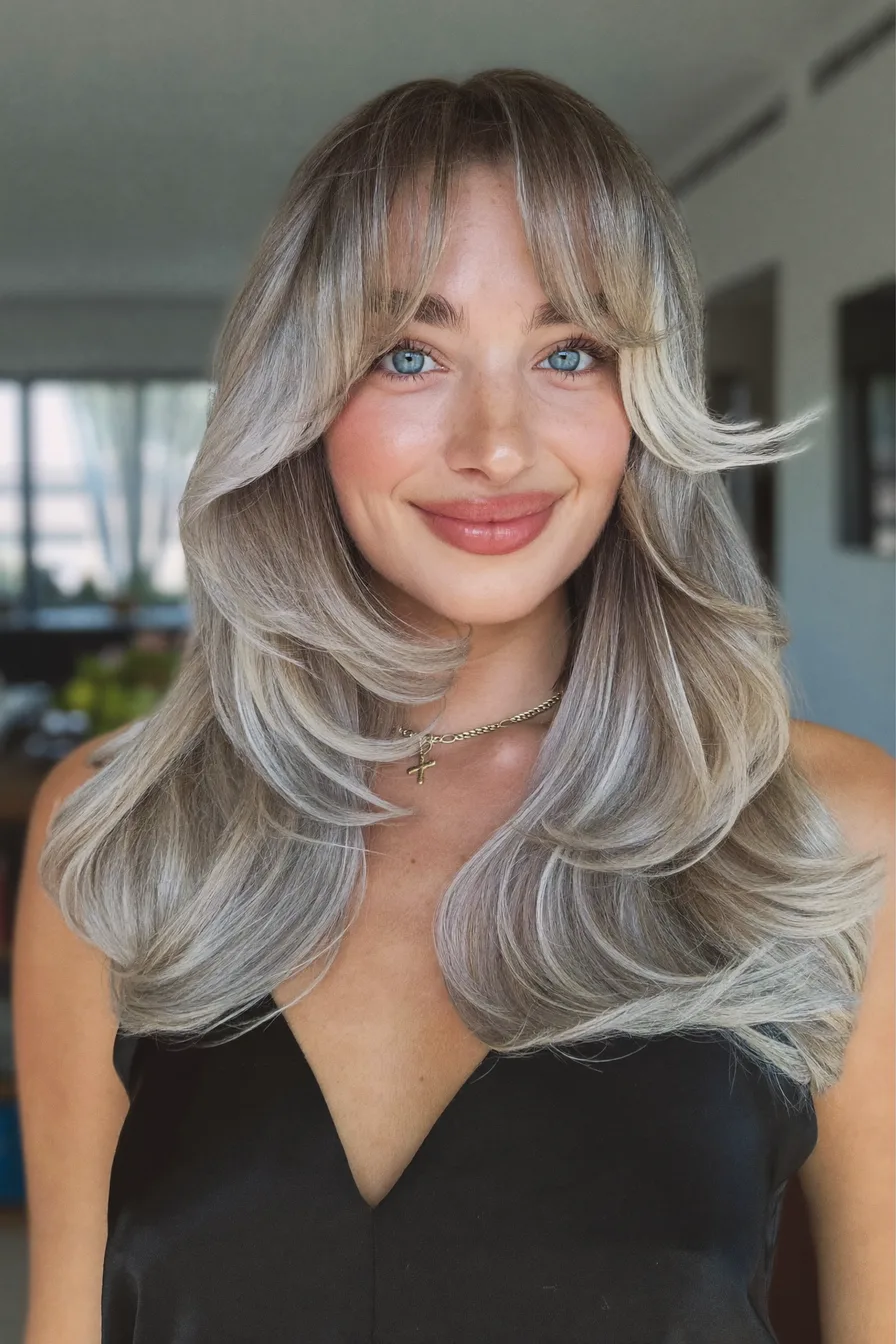 Face-Framing Layers with Curtain Bangs on Ash Blonde Shoulder-Length Hair