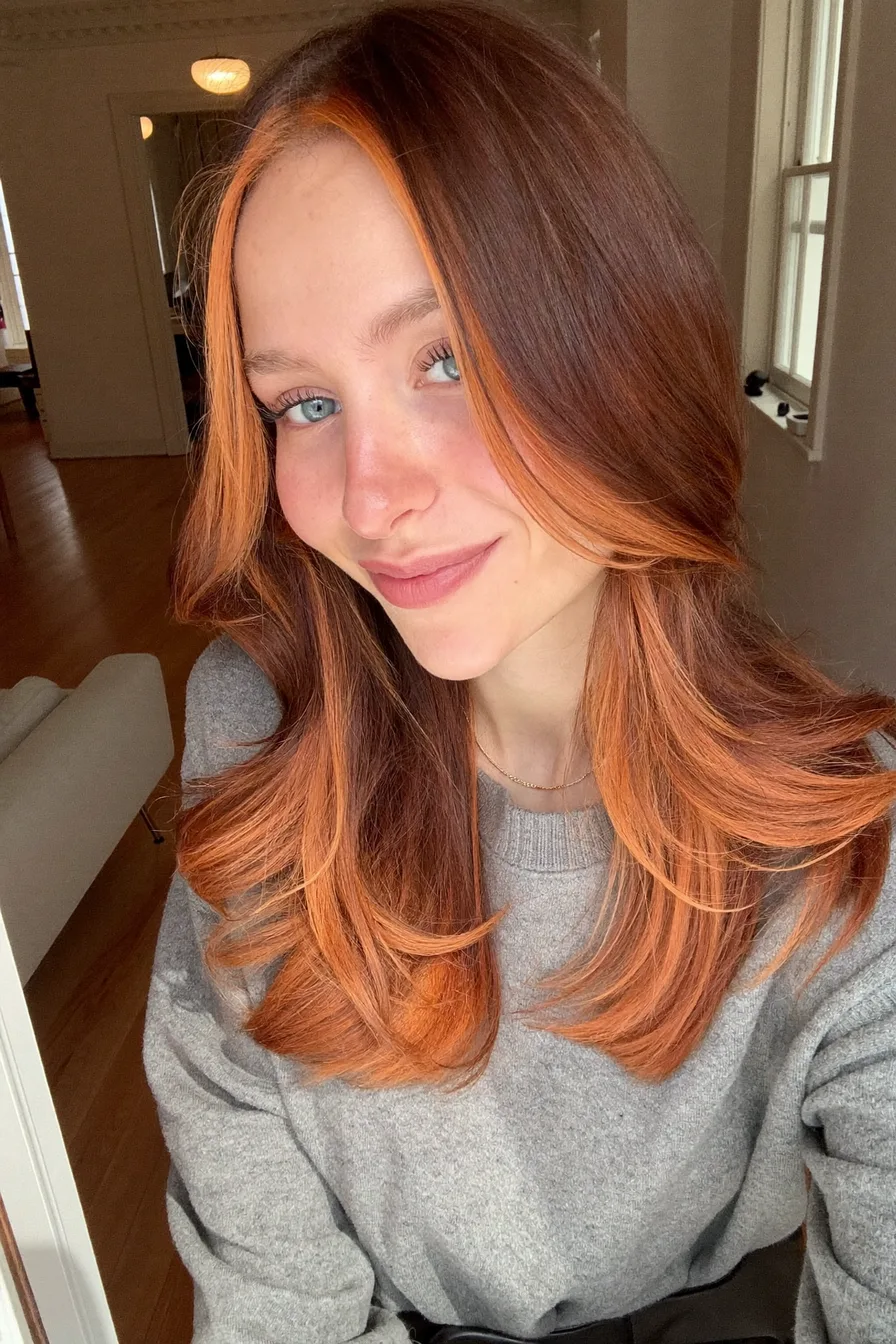 Face-Framing Shoulder-Length Layered Haircut with Bold Highlights