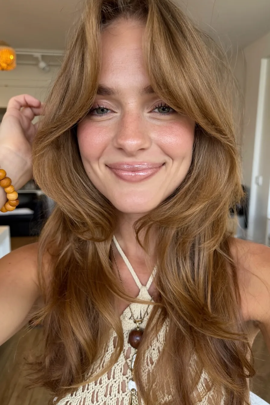 Face-Framing Feathered Shoulder-Length Layered Haircut with Soft Bangs