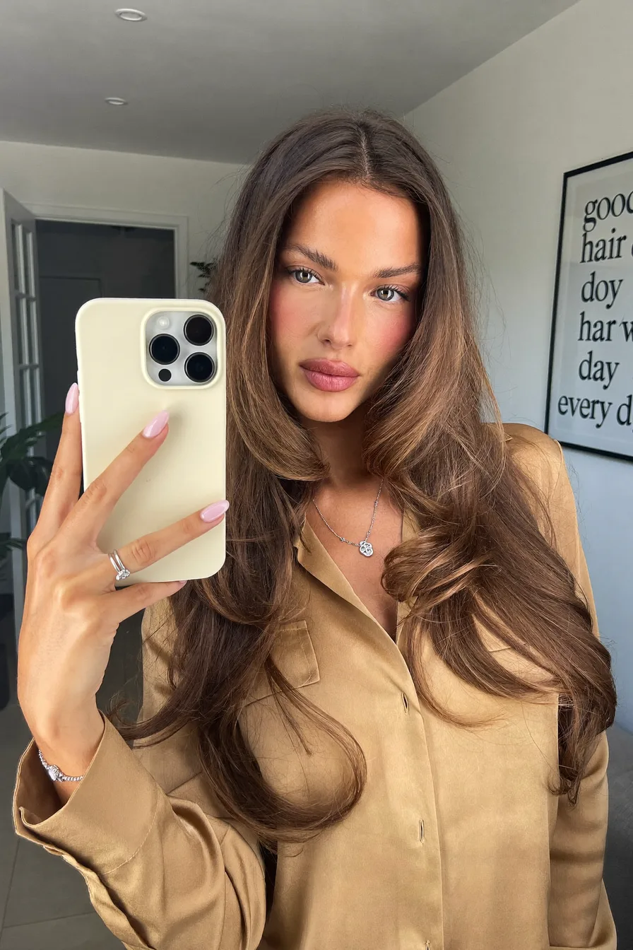 Caramel Brown Wavy Long Layered Haircut with Face-Framing Volume