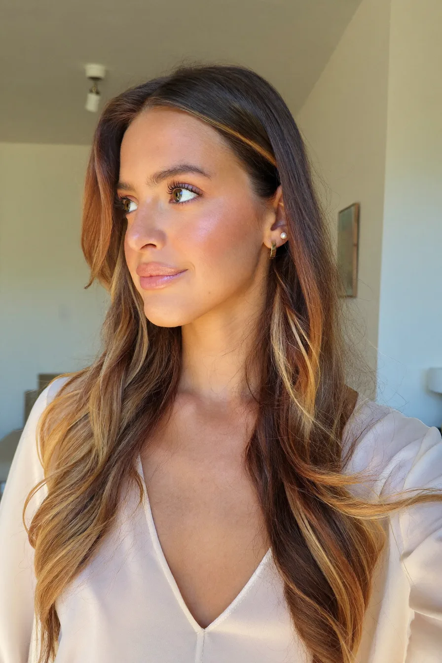 Effortlessly Chic Chestnut Brown Wavy Long Layered Hairstyle