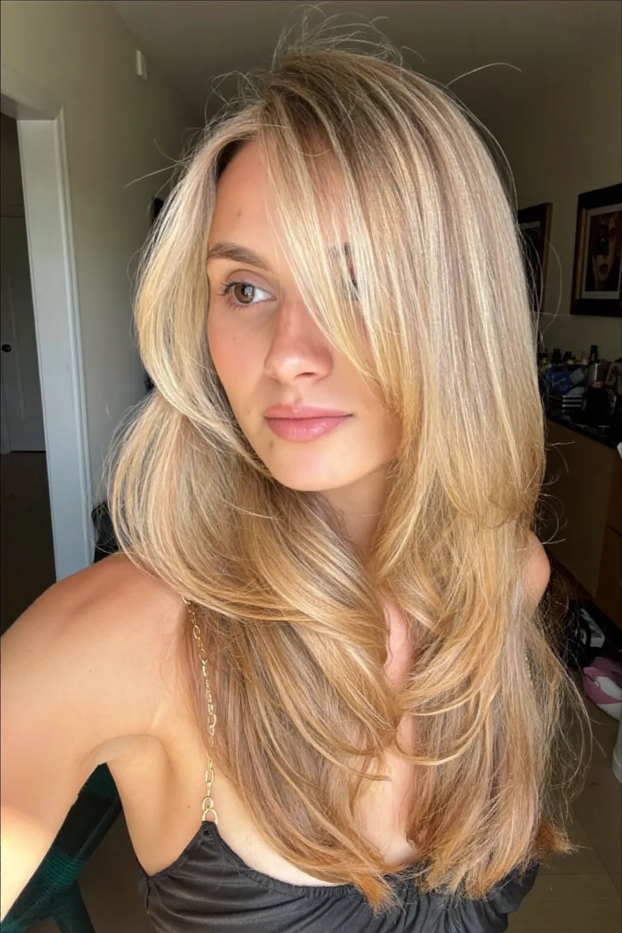 Honey Blonde Wavy Long Layered Hair with Face-Framing Volume