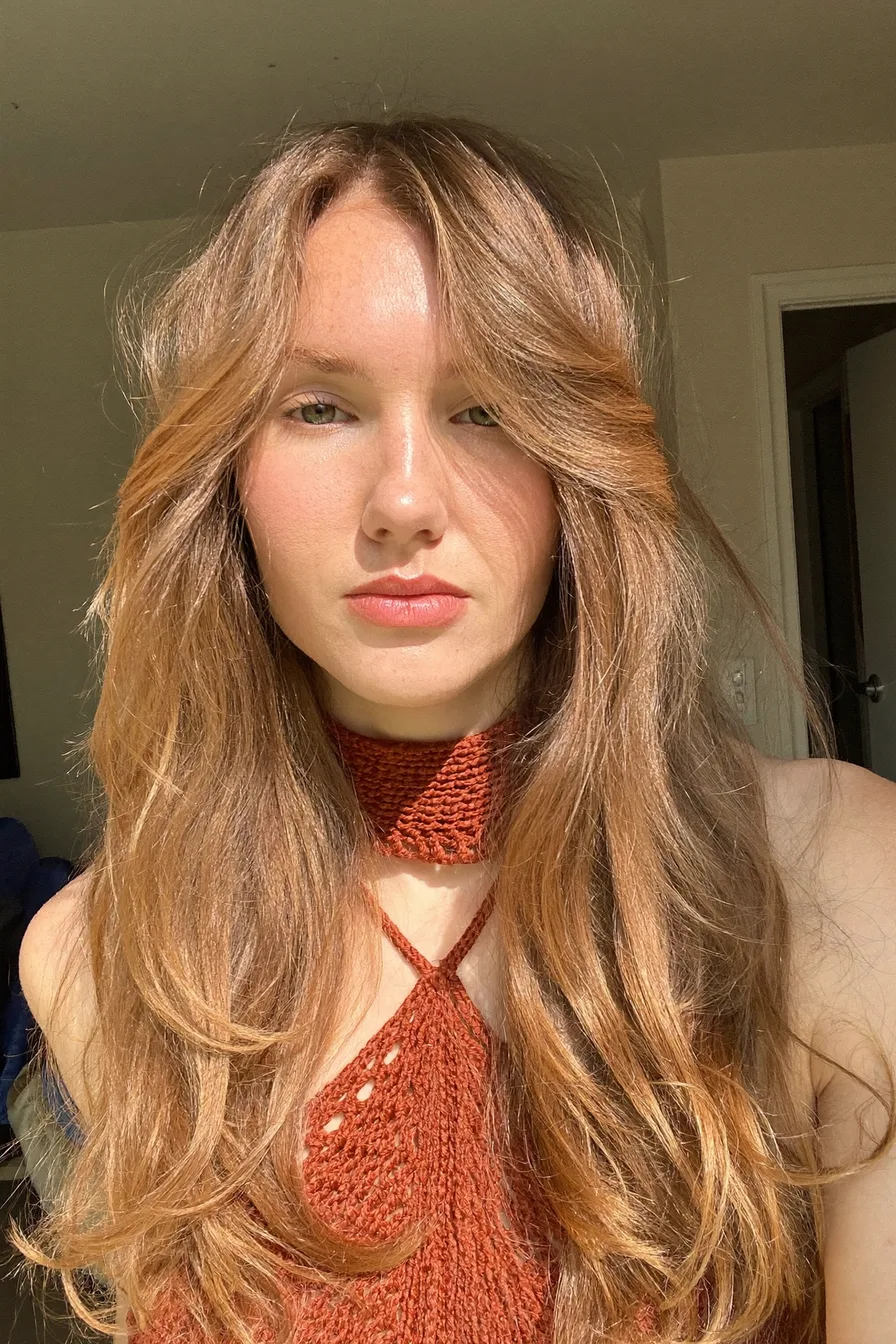 Sun-Kissed Wavy Long Layered Haircut with Face-Framing Bangs